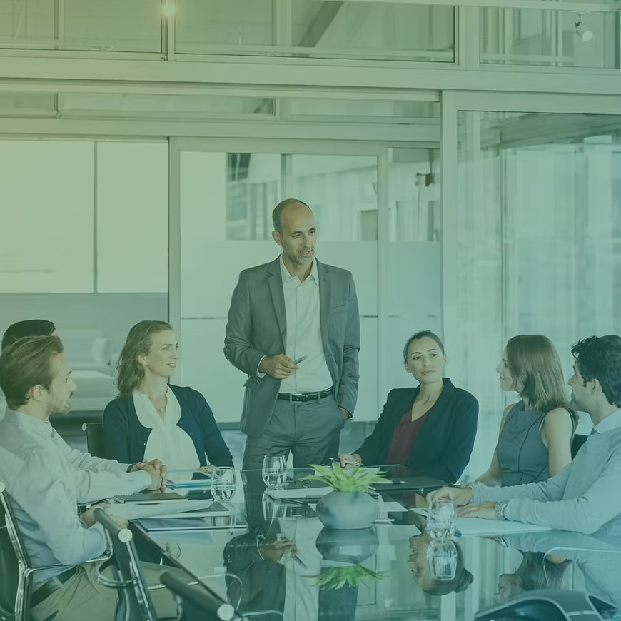 A group of people in a business meeting